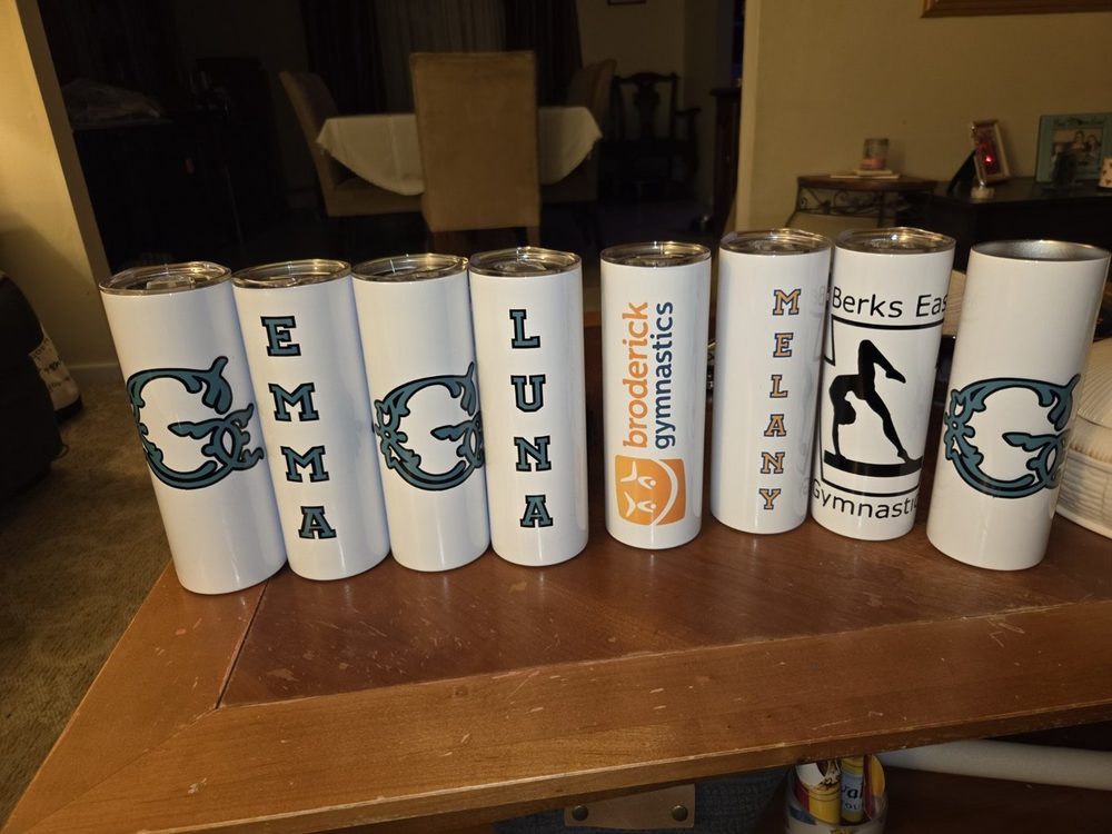 Collection of personalized gymnastics and name tumblers.